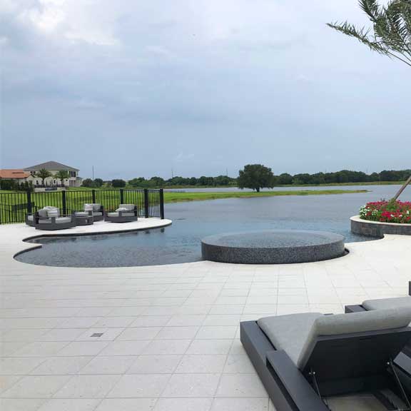 freeform pool design, infinity edge, with overflow spa